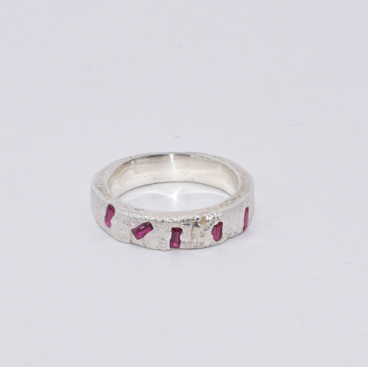 Naturally textured Sterling Silver band with 5 Ruby baguettes scattered across the front